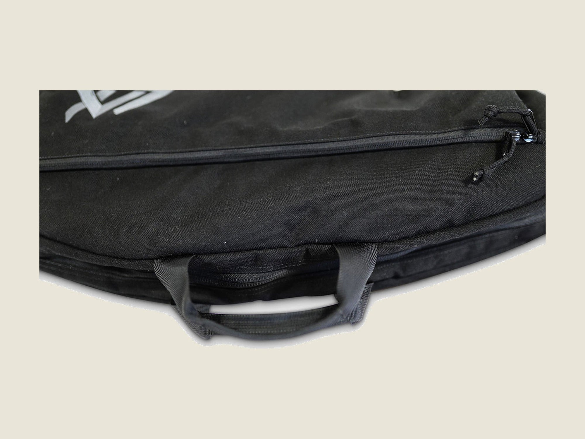 R2 bow case black, pocket zip and carry handle detail